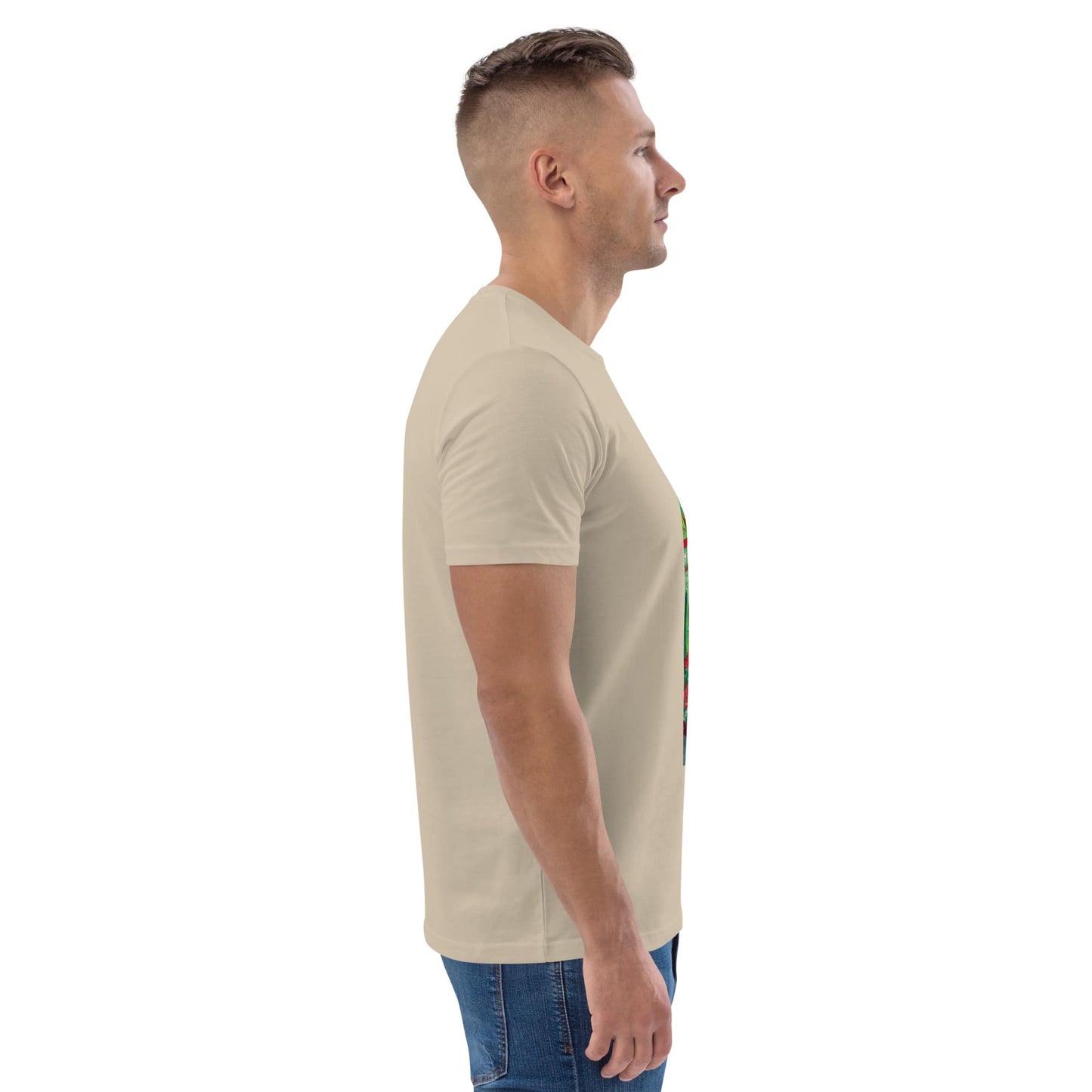 Side view of man wearing a beige t-shirt with a graphic design on a white background