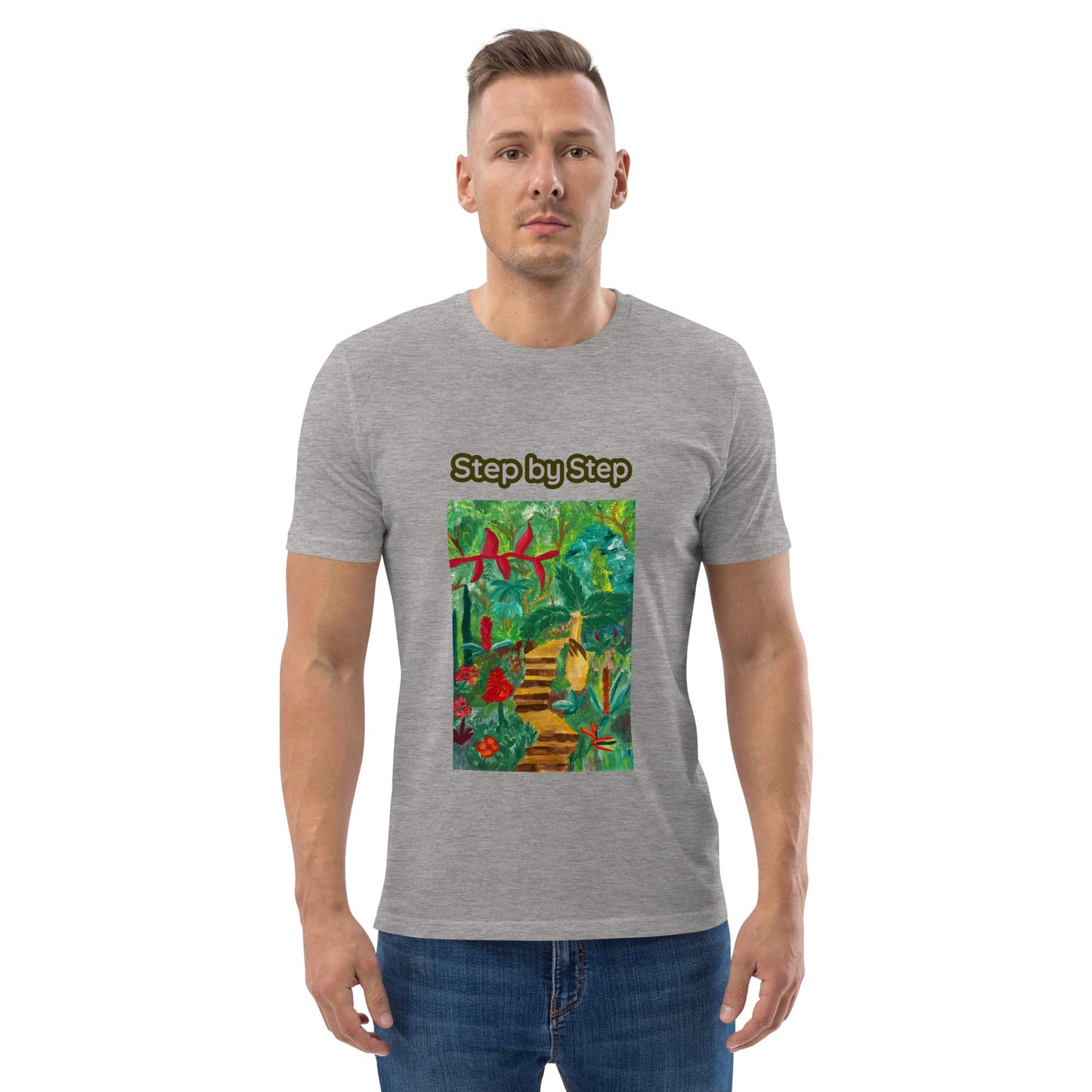 Man wearing a gray t-shirt with a colorful artwork of plants and 'Step by Step' text on a white background