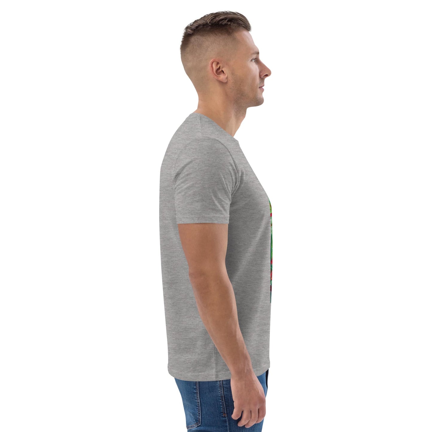 Side view of man wearing a gray t-shirt with a tropical design on the chest against a white background