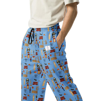Close-up of men’s joggers with handpainted London-themed print in blue, featuring Tower Bridge, red buses, and phone booths, designed by Anke Wonder.