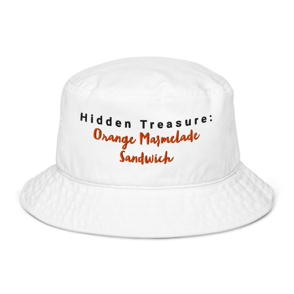 White embroidered bucket hat with the phrase "Hidden Treasure: Orange Marmalade Sandwich" stitched in black and orange on the front.