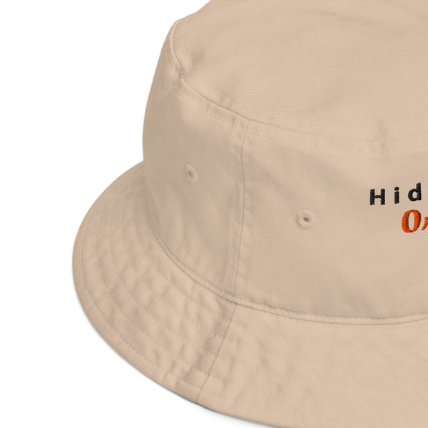 Side view close-up of the embroidered bucket hat, showcasing fine stitching and quality fabric with a slight curve in the brim.