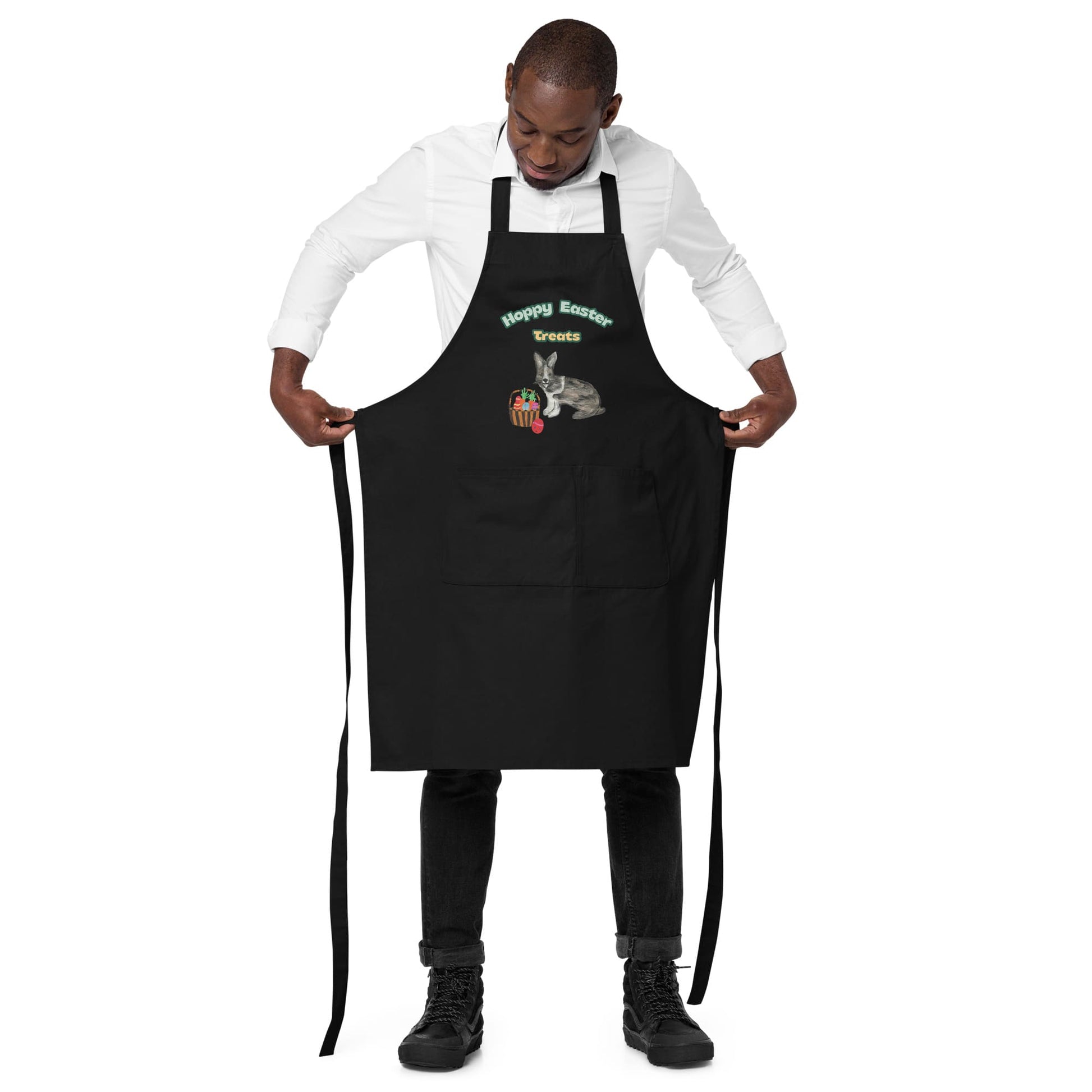 Man wearing black "Hoppy Easter Treats" apron, showing the adjustable straps.