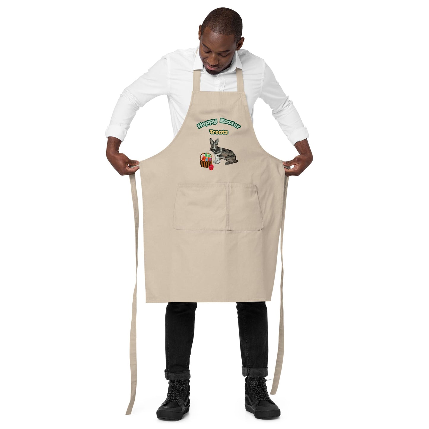 Man wearing natural color "Hoppy Easter Treats" apron, showing the adjustable straps.