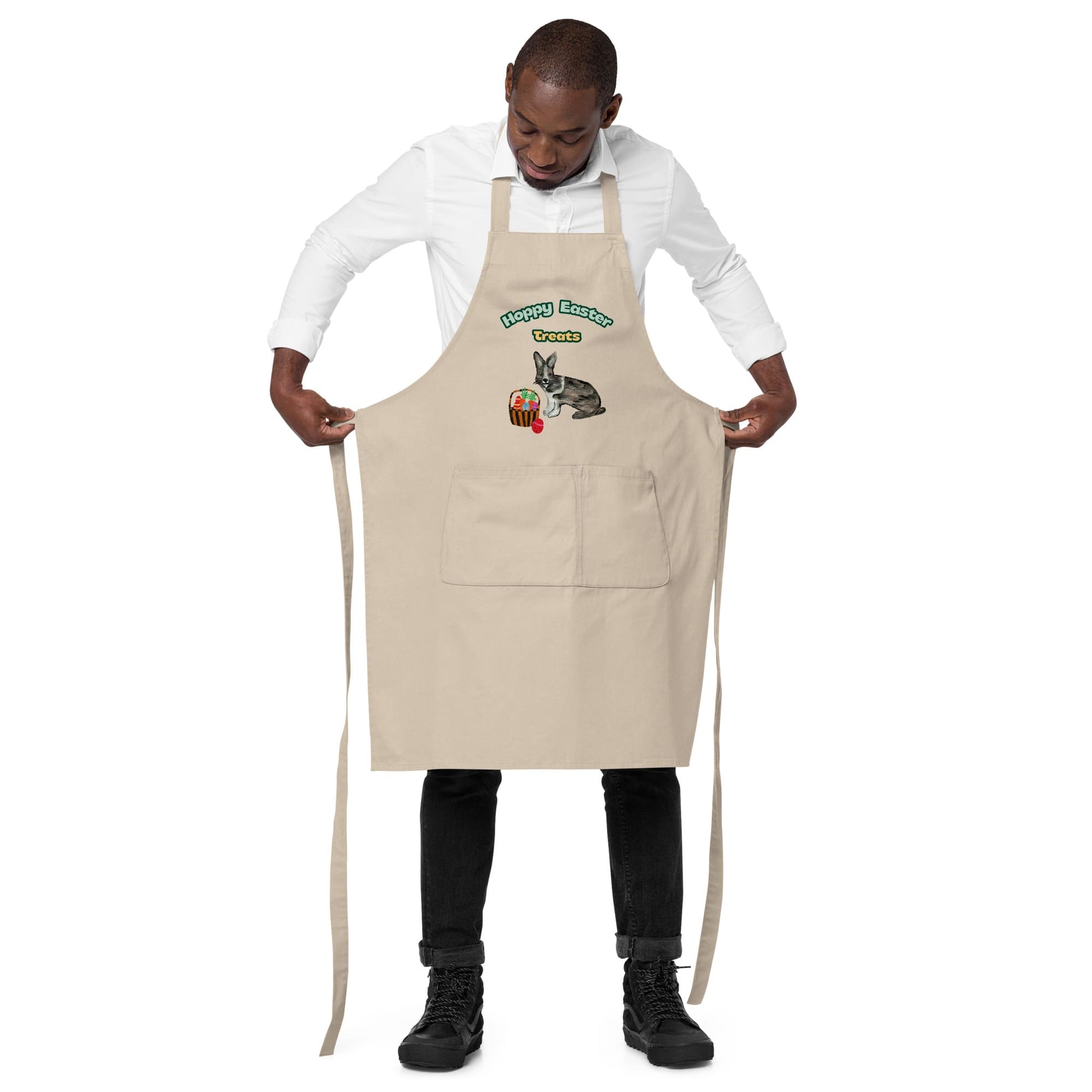 Man wearing natural color "Hoppy Easter Treats" apron, showing the adjustable straps.