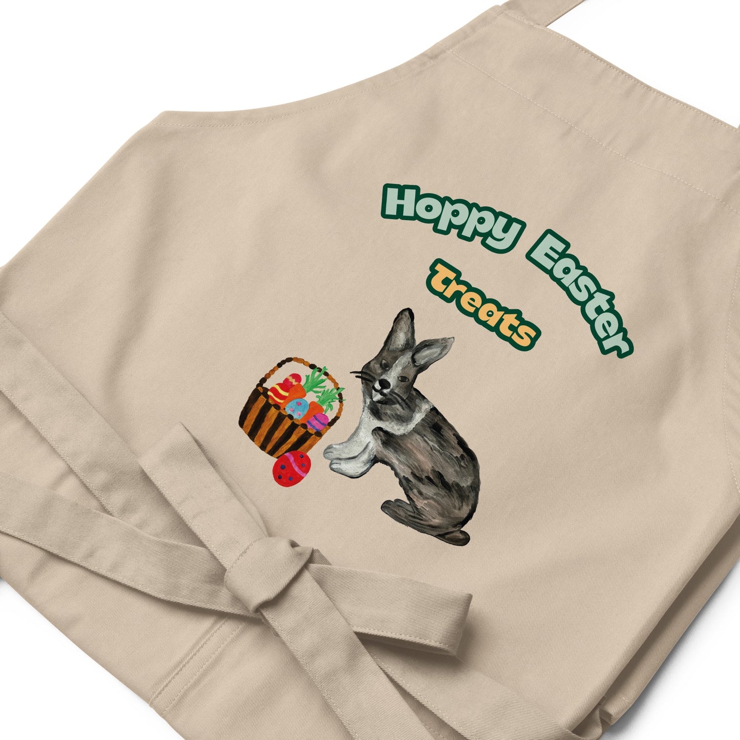 Close-up of "Hoppy Easter Treats" natural color apron design with bunny and eggs.