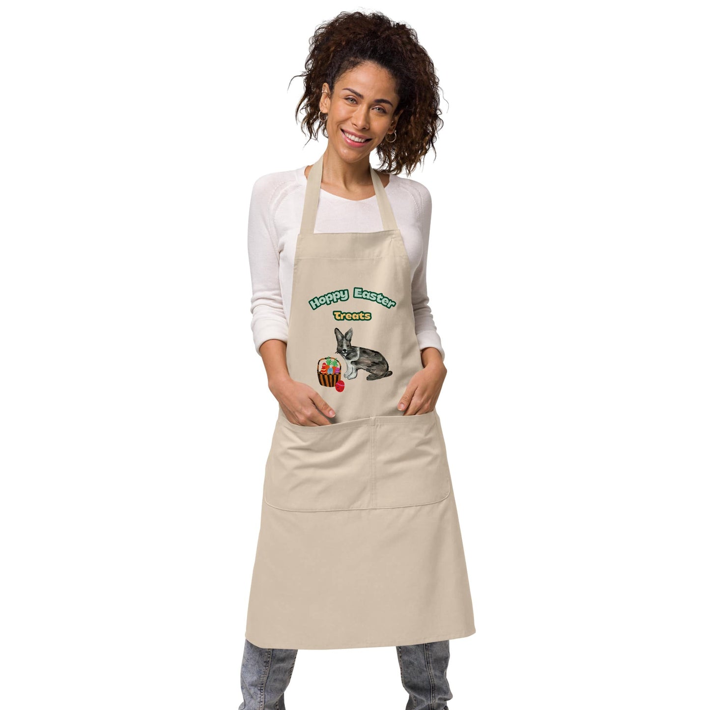 Woman wearing natural rope color "Hoppy Easter Treats" apron with hand-painted rabbit and Easter basket design.