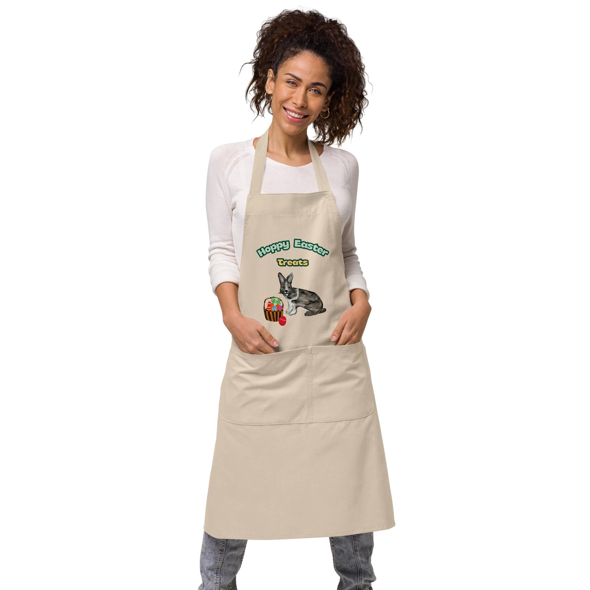 Woman wearing natural rope color "Hoppy Easter Treats" apron with hand-painted rabbit and Easter basket design.