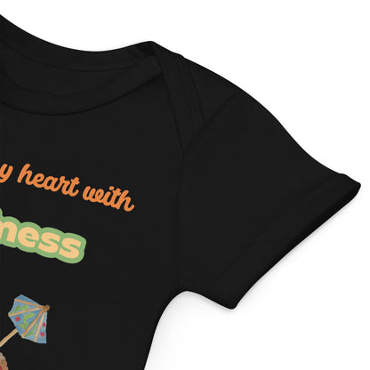 Envelope neck for easy dressing of black baby bodysuit with “You melt my heart with Happiness” and heart cone print.