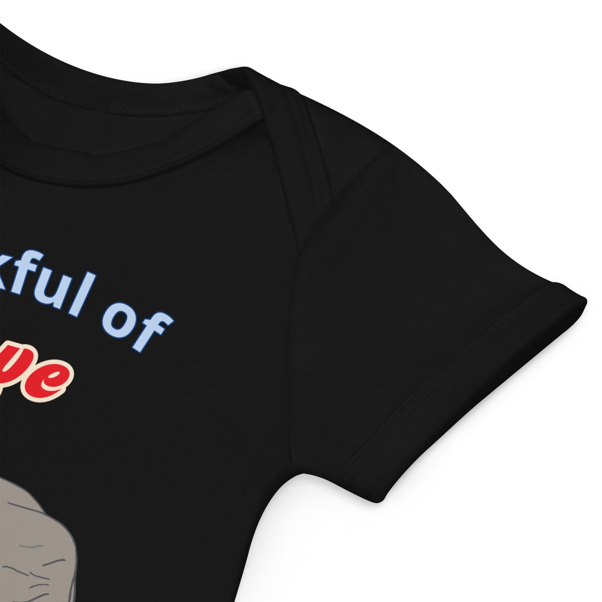 High-quality stitching on organic cotton black baby bodysuit sleeves with elephant design by Anke Wonder.