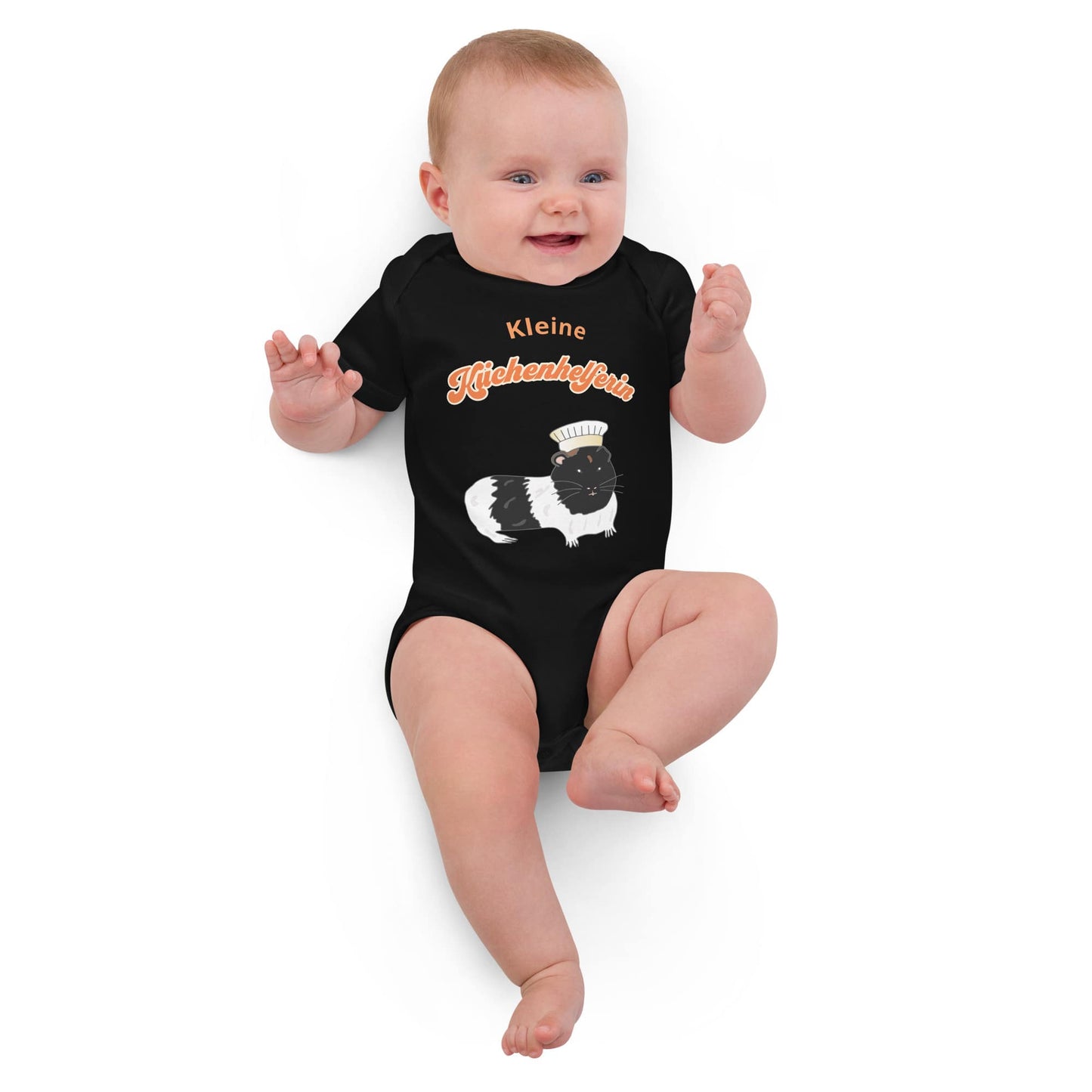 Baby Girl wearing an co-friendly black baby bodysuit with a cute guinea pig chef design with German phrase 'Kleine Küchenhelferin'.