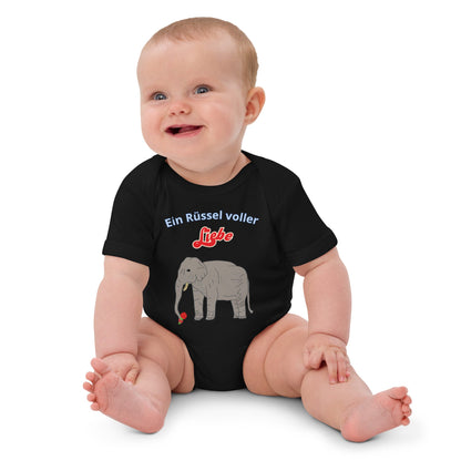 Black baby bodysuit with elephant design and flower in trunk worn by Baby girl.
