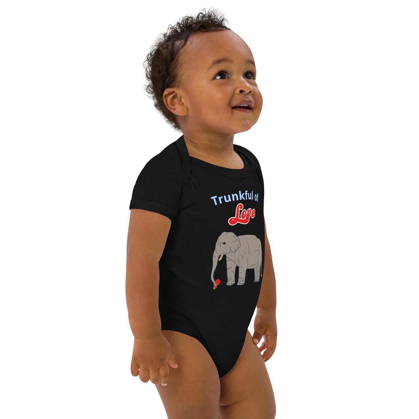 Right Front of baby boy in  a black organic cotton bodysuit with a cute elephant and red flower in trunk by Anke Wonder.