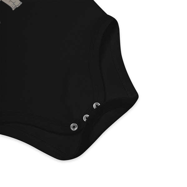 Nickel-free, secure snap fasteners for easy diaper changes on black organic cotton baby bodysuit with elephant design.