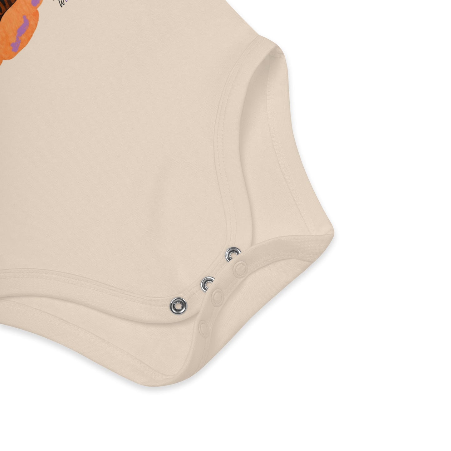 Close-up of a beige baby romper with button details on a white background