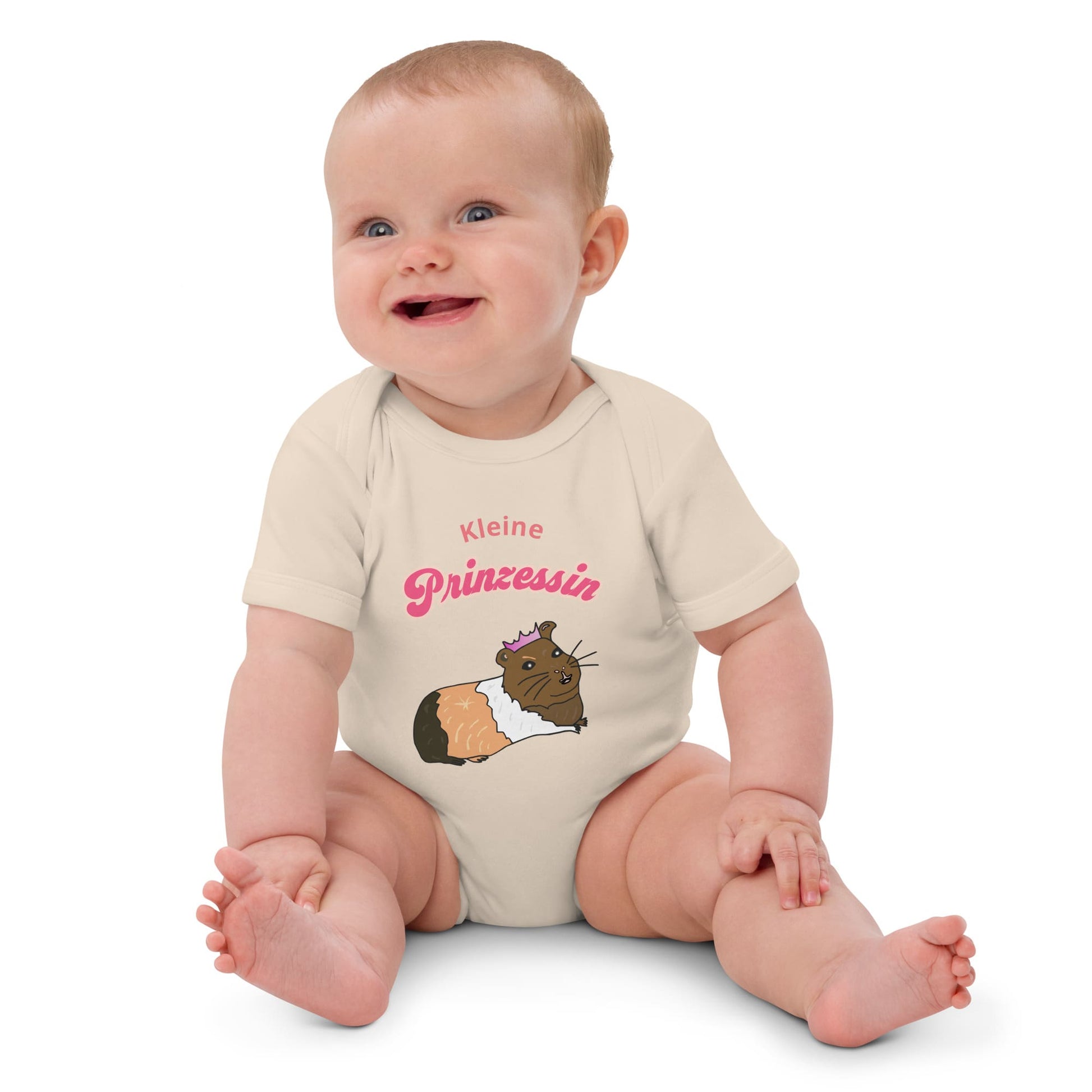 Organic baby girl bodysuit in natural color featuring "Kleine Prinzessin" text and a hand-painted guinea pig with a crown.