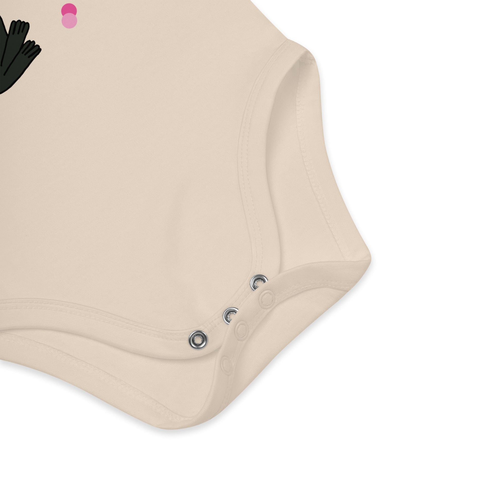 Detail of bottom snap closures made from nickel-free metal of natural colored baby bodysuit bunny with rose and decorative pink dots around the “My First Rose for You” print.