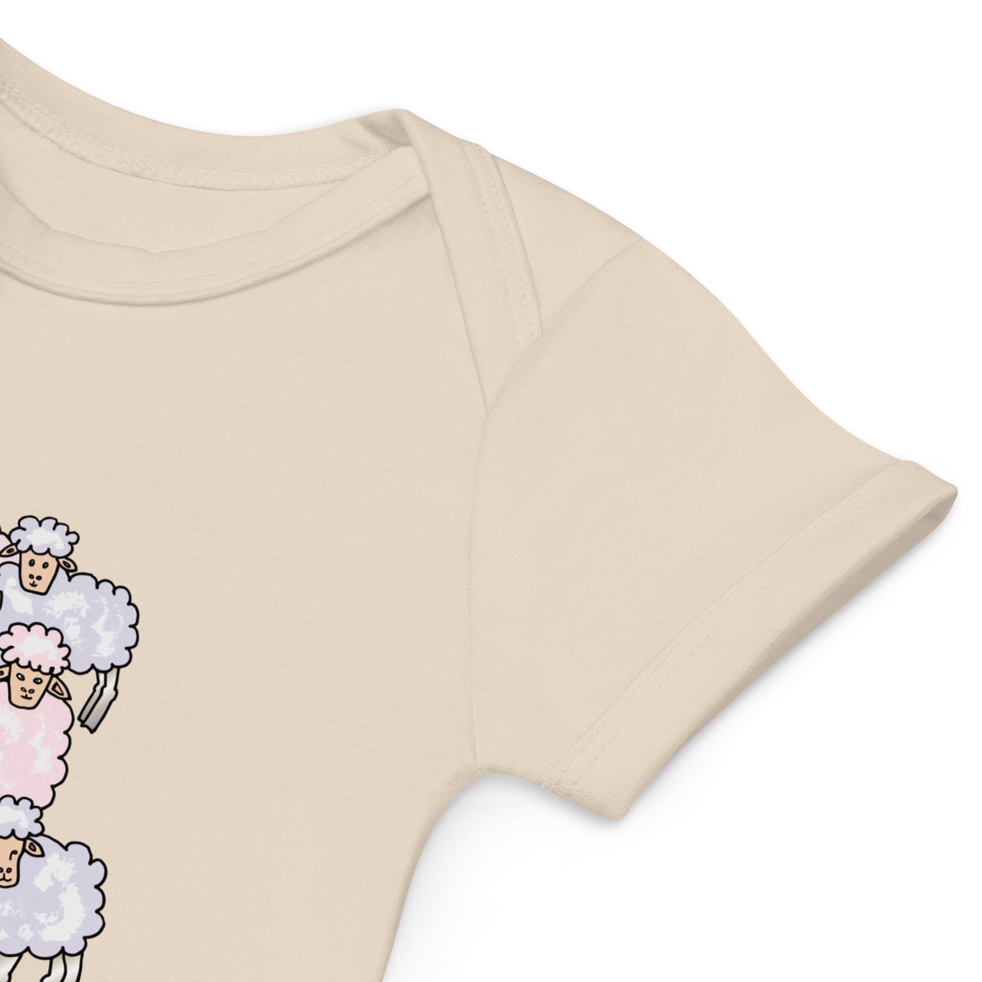 Close-up of envelope neckline on an organic cotton baby natural color bodysuit for easy dressing.