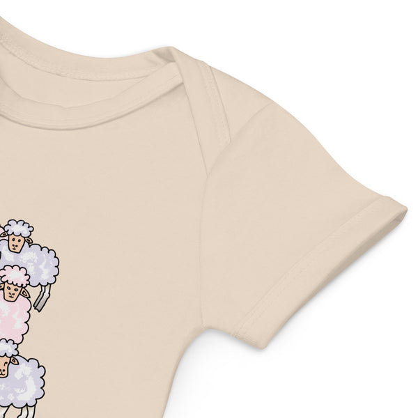 Close-up of envelope neckline on an organic cotton baby natural color bodysuit for easy dressing.