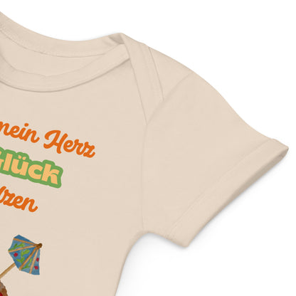 Soft envelope neckline for gentle on/off of natural baby bodysuit with German phrase and melting heart cone.