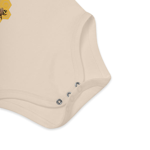 Zoomed-in view of the nickel-free snap fasteners on the natural organic cotton baby bodysuit for quick diaper changes.