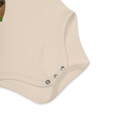 Three nickel-free snaps at the bottom of natural organic bodysuit featuring multicolor heart-shaped ice cream and German text.