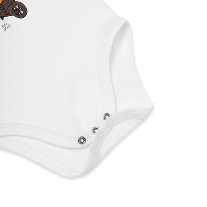 Close-up of a white baby onesie with button details on a light gray background