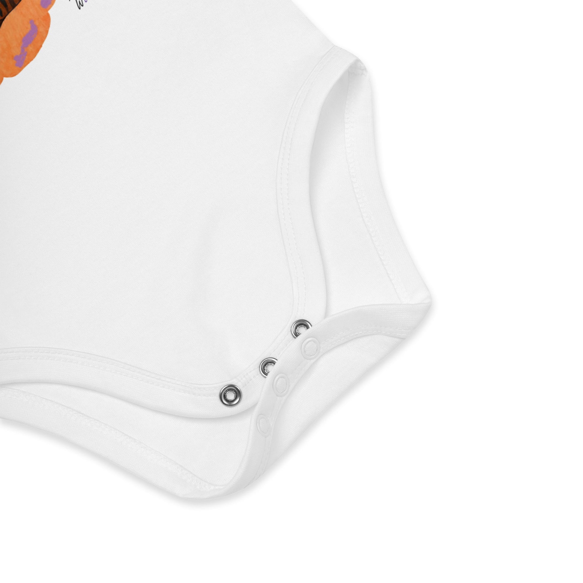 Close-up of a white baby romper with buttons on a white background