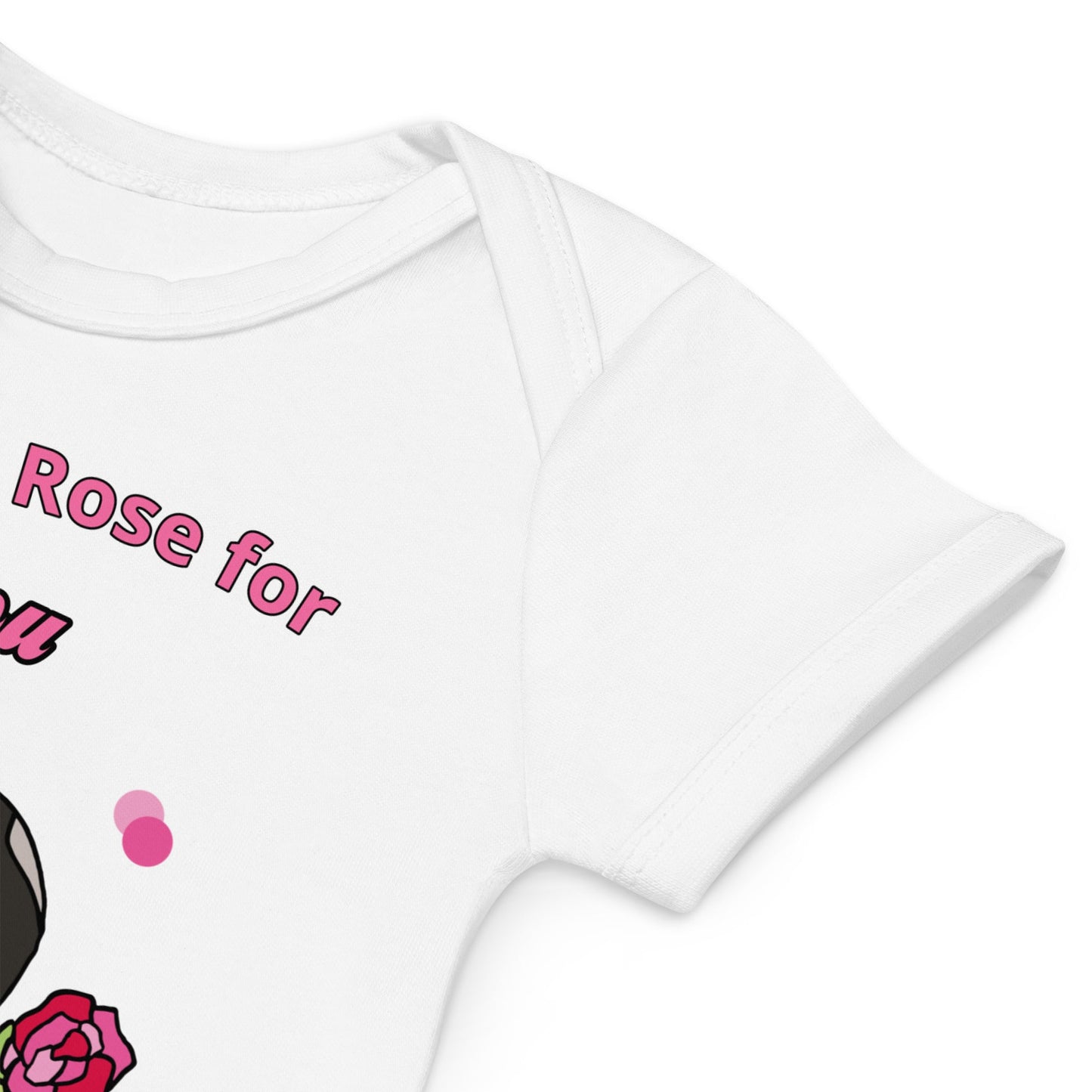 Envelope-style neckline designed for easy dressing and undressing of white organic cotton baby bodysuit with bunny holding a pink rose.