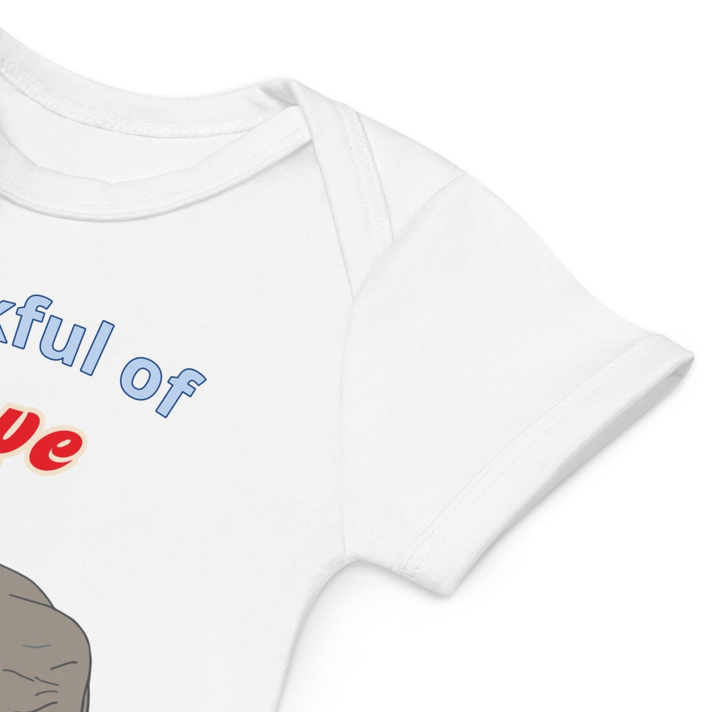 High-quality stitching on organic cotton white baby bodysuit sleeves with elephant design by Anke Wonder.