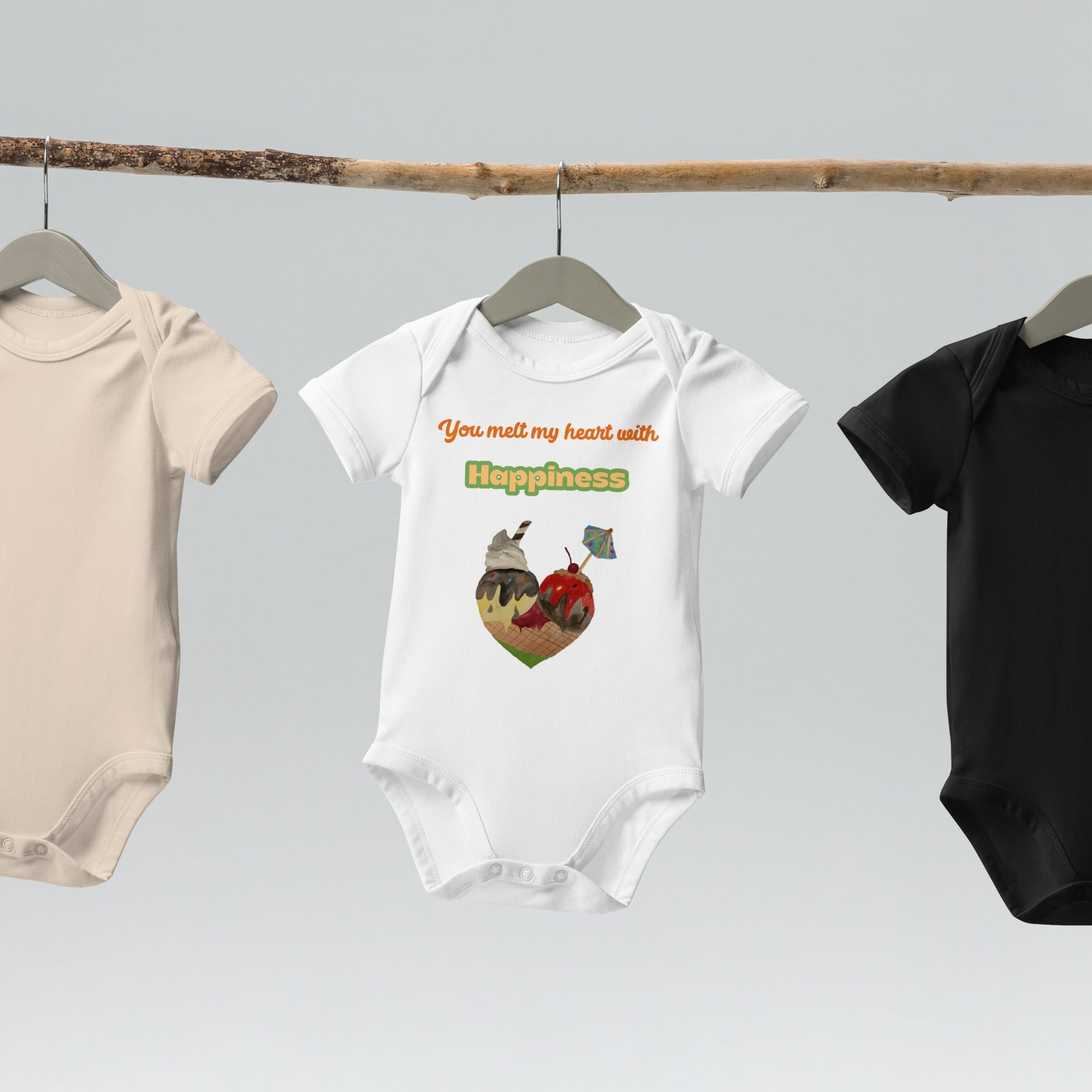 Organic baby bodysuit in white with a heart-shaped ice cream cone and the text “You melt my heart with Happiness.”