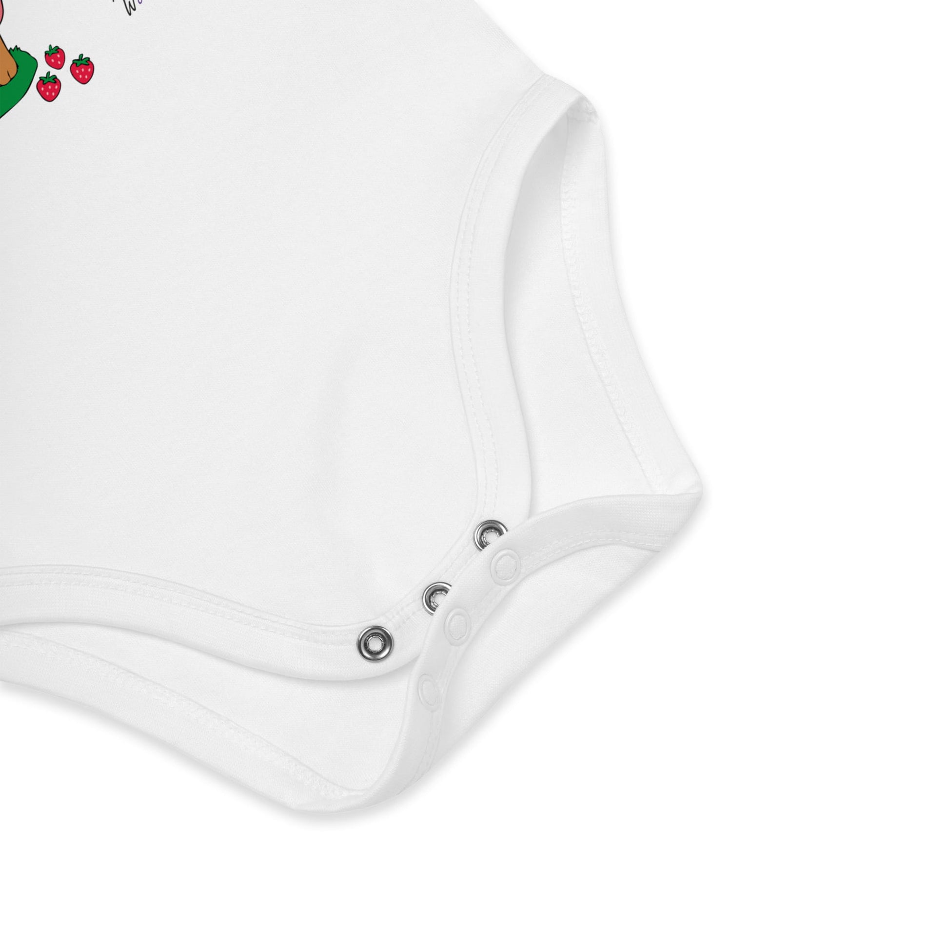 Close-up of a white baby romper with button details on a white background