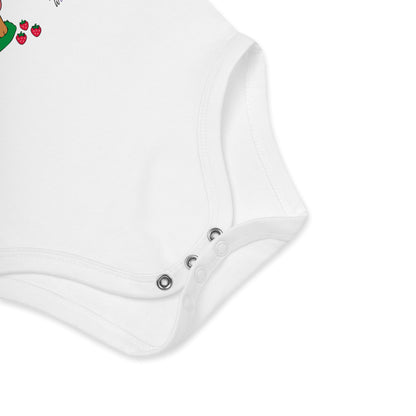 Close-up of a white baby romper with button details on a white background