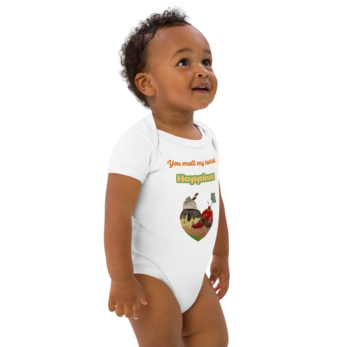 Front right of baby Boy wearing white baby bodysuit with “You melt my heart with Happiness” and heart cone print.