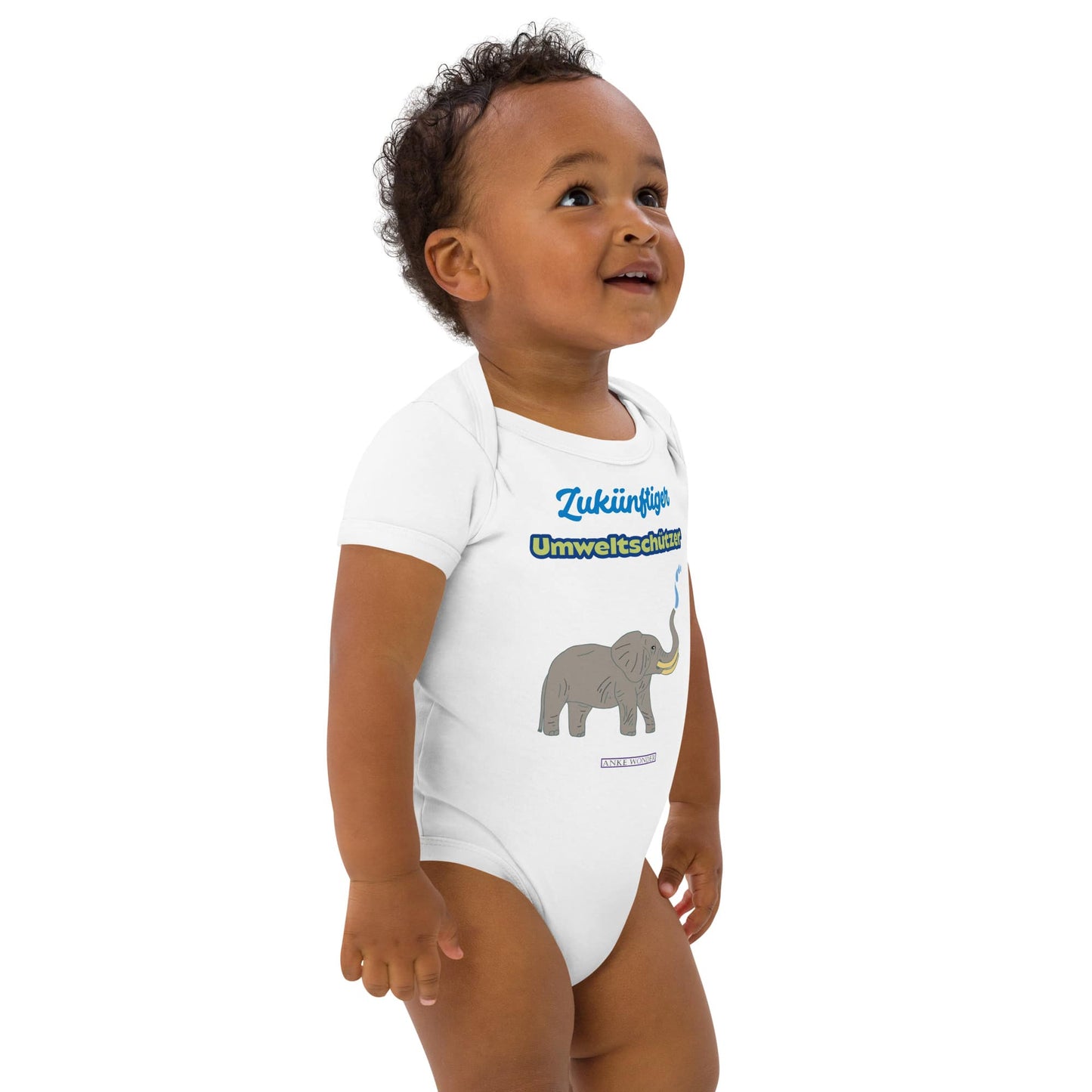Baby wearing a white onesie with elephant graphic and eco slogan 'Zukünftiger Umweltschützer' on a white background