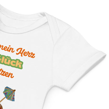 Soft envelope neckline for gentle on/off of white baby bodysuit with German phrase and melting heart cone.