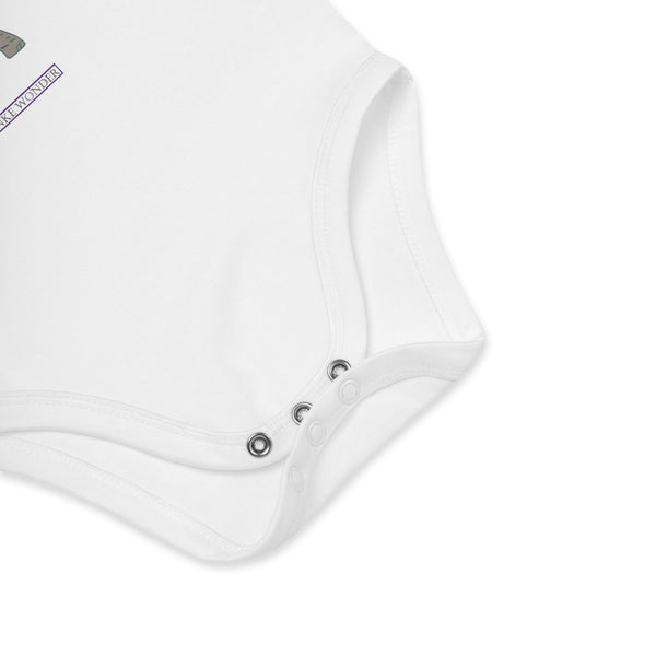 Three nickel-free snaps at the bottom of white baby bodysuit for convenience by Anke Wonder.