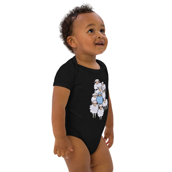 Side view of black boy wearing a black organic cotton bodysuit with blue sheep design by Anke Wonder.