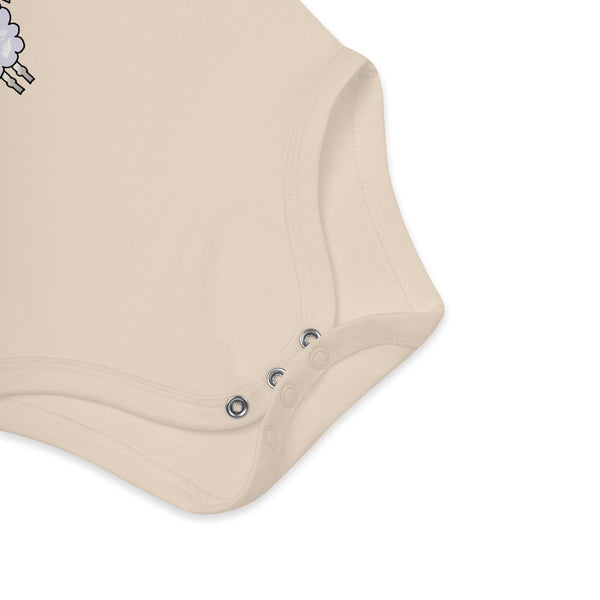 Snap closure detail on an organic cotton baby boy natural color bodysuit for quick and easy diaper changes.