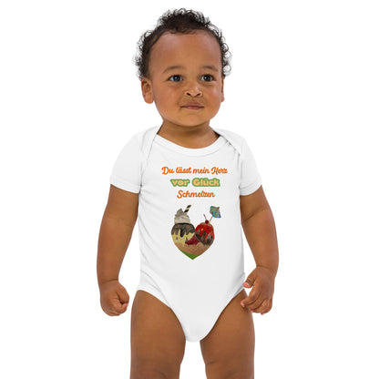 Baby boy wearing white organic bodysuit with colorful German quote 'Du lässt mein Herz vor Glück schmelzen' and ice cream cone heart.