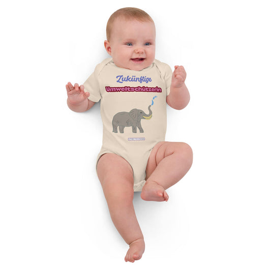 Baby girl in natural organic bodysuit with German slogan “Zukünftige Umweltschützerin” and elephant design.