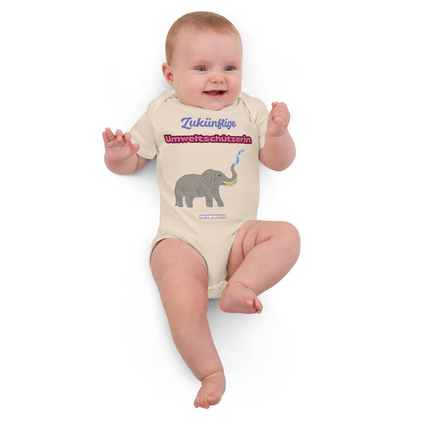 Baby girl in natural organic bodysuit with German slogan “Zukünftige Umweltschützerin” and elephant design.
