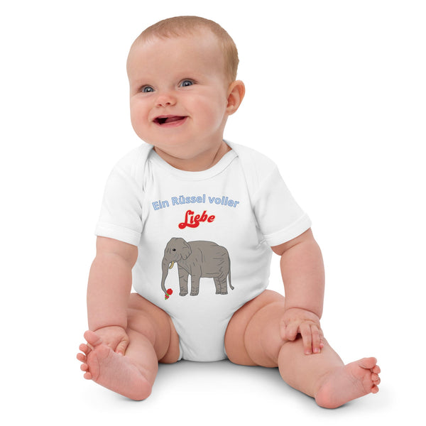 White baby bodysuit made from organic cotton featuring an elephant and German text 'Ein Rüssel voller Liebe' by Anke Wonder.
