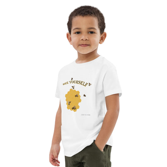 Boy wearing a white t-shirt with a bee graphic and text 'Bee Yourself' on a white background