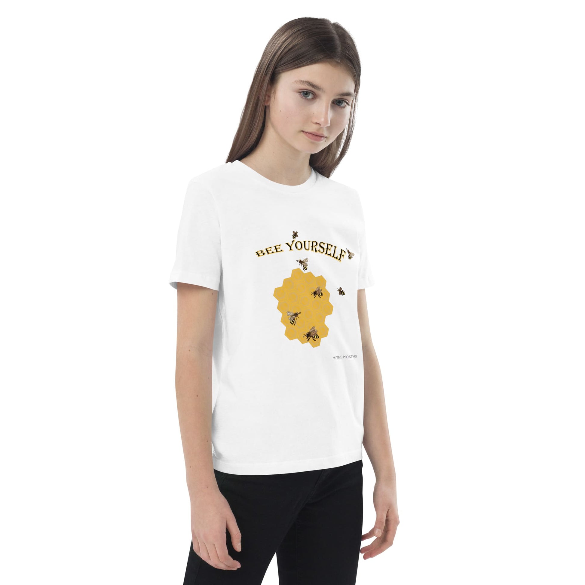 Front side view of girl wearing a white t-shirt with a graphic design and 'Bee Yourself' text on a white background