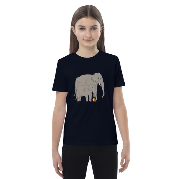 Front view of girl wearing a black t-shirt with elephant and baby design by Anke Wonder.