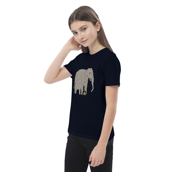 Side view of girl wearing a black t-shirt with elephant and baby design by Anke Wonder.