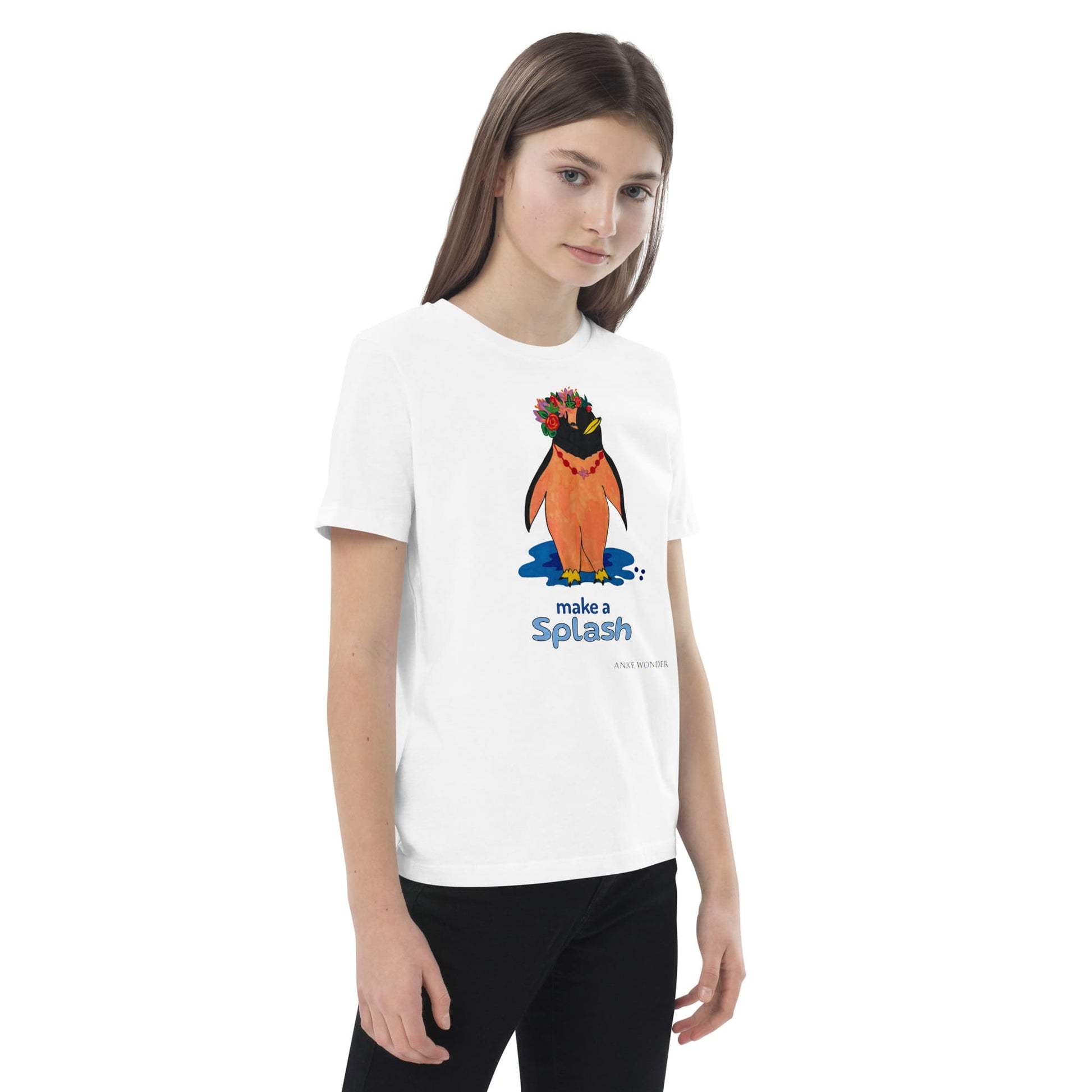 Young girl wearing a white t-shirt with a colorful penguin graphic and text 'make a splash' on a white background