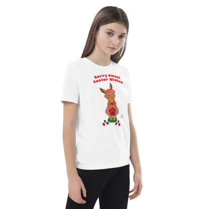 Girl wearing a white t-shirt with a Easter bunny design and text.
