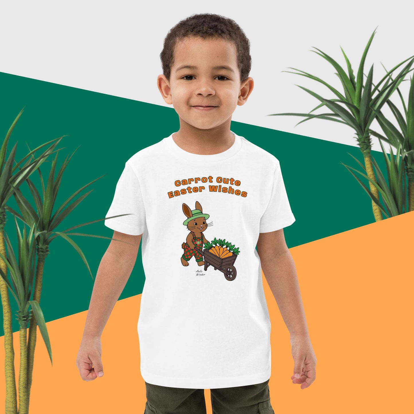 Child wearing a white t-shirt with a cartoon bunny character and Easter text, standing against a green and orange background with plants.